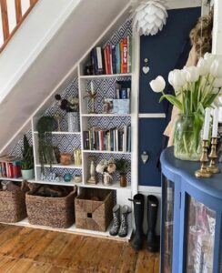 storage for under the stairs with bookshelves, baskets for shoes and cupboards