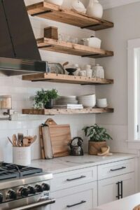 a clean kitchen with rustic shelves and tableware, white marble countertops and white subway tiles