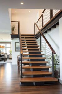 a cast iron stair railing with oak steps