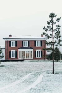 white and gray house under white clouds